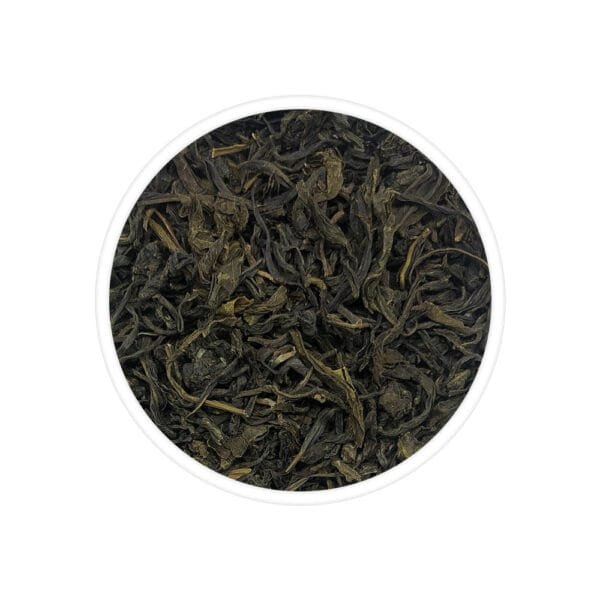 An inviting cup of Socklatinga Green Tea, featuring vibrant green tea leaves gently steeping in a teapot, radiating a sense of freshness and tranquility.